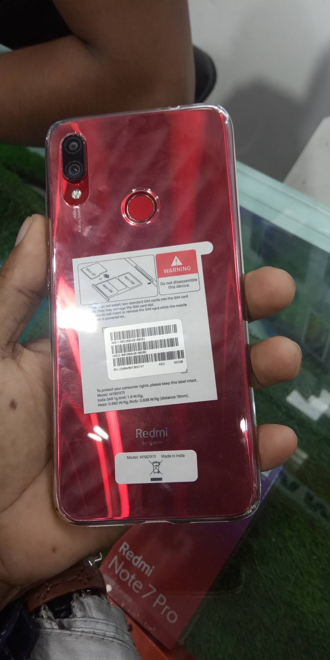 A thumb unlocks a smartphone using its fingerprint login sensor for security.