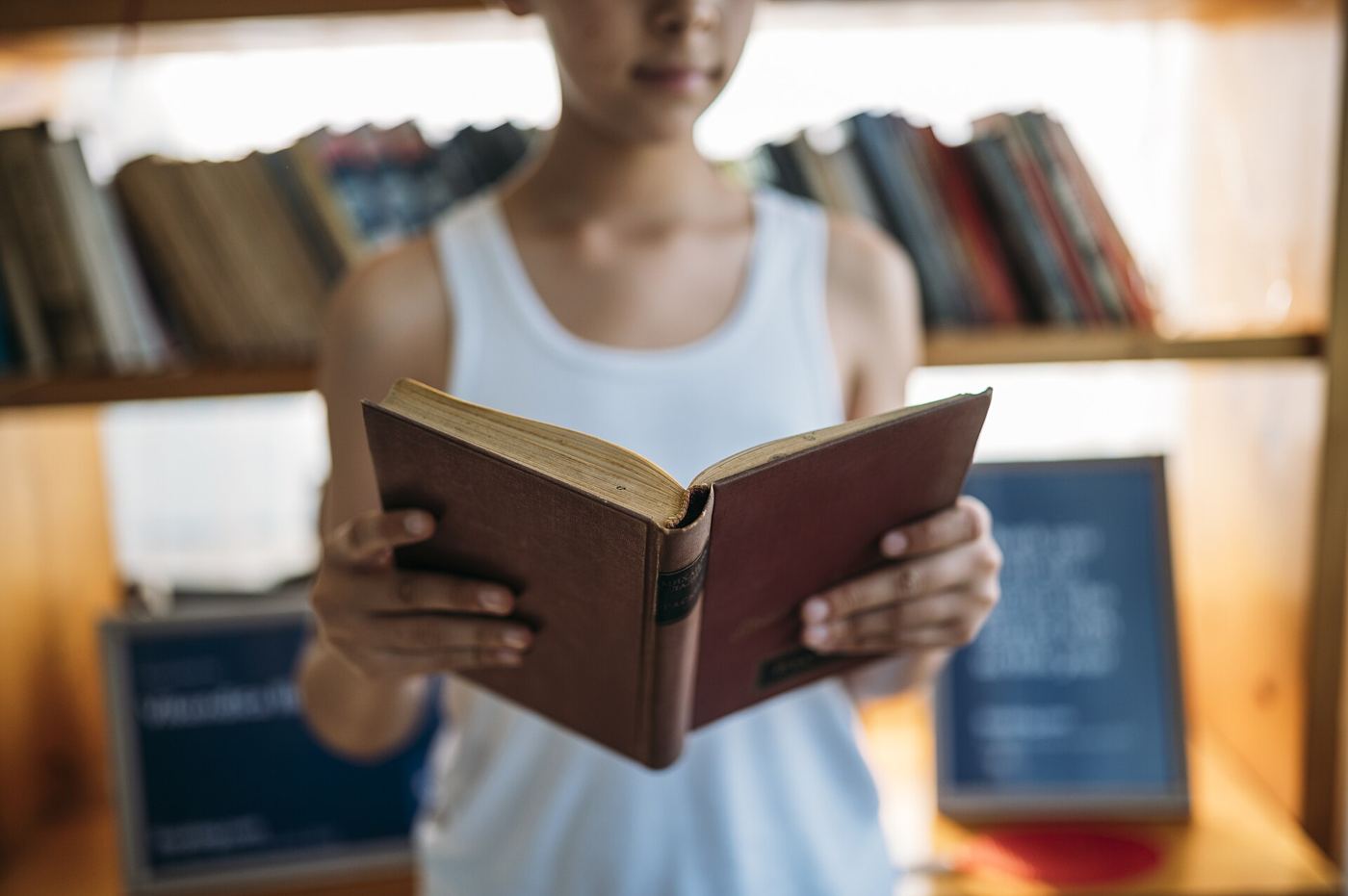 Reading Habits and Attention in a Distracted Age Person reading a book in a library
